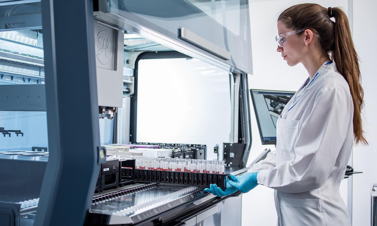 Semi-automated pipetting robot loading sample racks in the ender screening lab